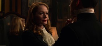 Movie still from “Chilling Adventures of Sabrina” (2018), created by Roberto Aguirre-Sacasa – A woman in a white blouse and a black jacket; Close Up shot, Over the shoulder angle