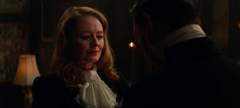 Movie still from “Chilling Adventures of Sabrina” (2018), created by Roberto Aguirre-Sacasa – A man and a woman are talking to each other in the dark; Close Up shot, Over the shoulder angle