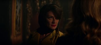 Movie still from “Chilling Adventures of Sabrina” (2018), created by Roberto Aguirre-Sacasa – A person wearing a yellow jacket; Close Up shot, Over the shoulder angle