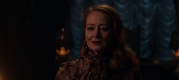 Movie still from “Chilling Adventures of Sabrina” (2018), created by Roberto Aguirre-Sacasa – A person wearing a dress; Close Up shot, Over the shoulder angle