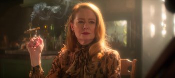 Movie still from “Chilling Adventures of Sabrina” (2018), created by Roberto Aguirre-Sacasa – A person with long hair; Close Up shot, Low angle