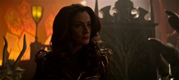 Movie still from “Chilling Adventures of Sabrina” (2018), created by Roberto Aguirre-Sacasa – A person with long brown hair; Close Up shot, Over the shoulder angle