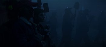 Movie still from “Chilling Adventures of Sabrina” (2018), created by Roberto Aguirre-Sacasa – A group of people standing in the dark; Medium shot, Low angle