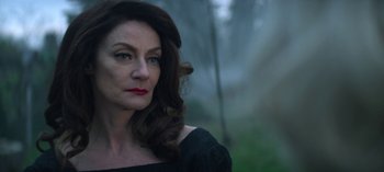 Movie still from “Chilling Adventures of Sabrina” (2018), created by Roberto Aguirre-Sacasa – A person with long hair; Close Up shot, Over the shoulder angle