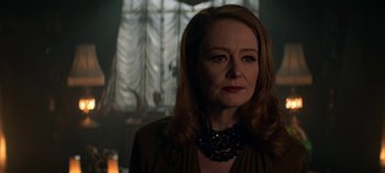 Movie still from “Chilling Adventures of Sabrina” (2018), created by Roberto Aguirre-Sacasa – A person with long hair; Close Up shot, Over the shoulder angle