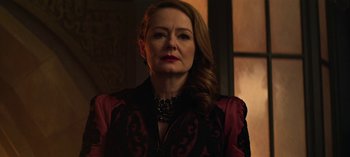 Movie still from “Chilling Adventures of Sabrina” (2018), created by Roberto Aguirre-Sacasa – A person with long hair wearing a dress; Close Up shot, Low angle