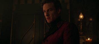 Movie still from “Chilling Adventures of Sabrina” (2018), created by Roberto Aguirre-Sacasa – A person wearing a red jacket; Close Up shot, Low angle