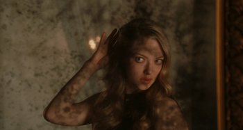 Movie still from “Chloe” (2009), directed by Atom Egoyan – A beautiful young woman with long , blonde hair; Close Up shot, High angle