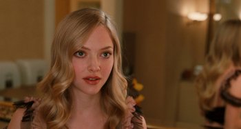 Movie still from “Chloe” (2009), directed by Atom Egoyan – A beautiful young lady with long blonde hair; Close Up shot, Over the shoulder angle