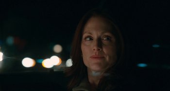 Movie still from “Chloe” (2009), directed by Atom Egoyan – A person looking at the camera; Close Up shot, Low angle