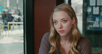 Movie still from “Chloe” (2009), directed by Atom Egoyan – A person with long blonde hair; Close Up shot, Over the shoulder angle