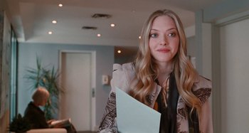 Movie still from “Chloe” (2009), directed by Atom Egoyan – A beautiful young woman holding a piece of paper; Close Up shot, Over the shoulder angle