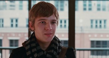 Movie still from “Chloe” (2009), directed by Atom Egoyan – A person wearing a jacket and scarf; Close Up shot, Over the shoulder angle