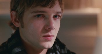 Movie still from “Chloe” (2009), directed by Atom Egoyan – A young man's face; Close Up shot, Over the shoulder angle