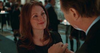 Movie still from “Chloe” (2009), directed by Atom Egoyan – A man and a woman talking to each other; Close Up shot, Over the shoulder angle