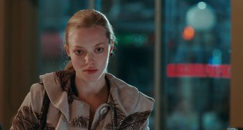 Movie still from “Chloe” (2009), directed by Atom Egoyan – A woman with blonde hair wearing a jacket; Close Up shot, Over the shoulder angle
