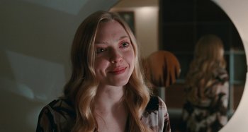 Movie still from “Chloe” (2009), directed by Atom Egoyan – A beautiful young woman with long blonde hair; Close Up shot, Over the shoulder angle