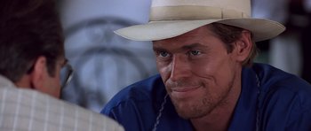 Movie still from “Clear and Present Danger” (1994), directed by Phillip Noyce – A person wearing a hat; Close Up shot, Over the shoulder angle
