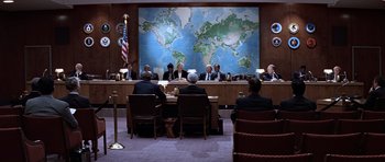Movie still from “Clear and Present Danger” (1994), directed by Phillip Noyce – A group of people sitting around a table in front of a map; Wide shot, High angle