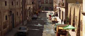 Movie still from “Clear and Present Danger” (1994), directed by Phillip Noyce – A city street filled with lots of water on a sunny day; Extreme Wide shot, High angle