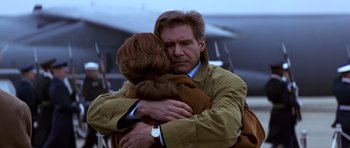 Movie still from “Clear and Present Danger” (1994), directed by Phillip Noyce – A man and a woman hugging each other; Close Up shot, Low angle