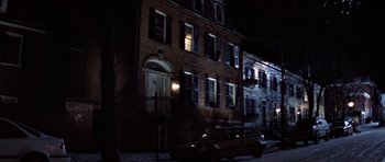 Movie still from “Clear and Present Danger” (1994), directed by Phillip Noyce – A car parked in front of a building at night; Extreme Wide shot, High angle