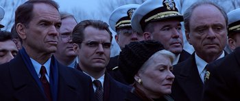 Movie still from “Clear and Present Danger” (1994), directed by Phillip Noyce – A group of men and women standing next to each other; Close Up shot, Low angle