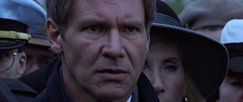 Movie still from “Clear and Present Danger” (1994), directed by Phillip Noyce – A person wearing a hat; Close Up shot, Over the shoulder angle