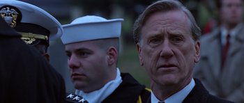 Movie still from “Clear and Present Danger” (1994), directed by Phillip Noyce – A man and a man in a uniform; Close Up shot, Low angle