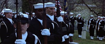 Movie still from “Clear and Present Danger” (1994), directed by Phillip Noyce – A group of men in navy uniforms holding rifles; Medium shot, Low angle