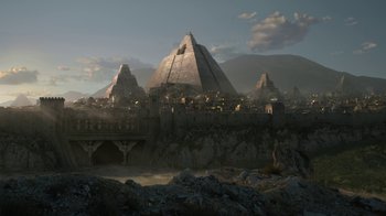 Movie still from “Game of Thrones” (2011), created by D.B. Weiss – An image of an ancient city in the desert; Extreme Wide shot, Low angle