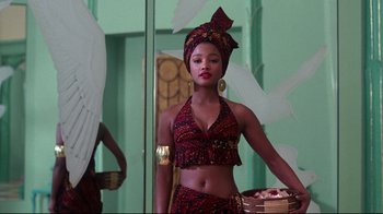 Movie still from “Coming to America” (1988), directed by John Landis – A beautiful young woman wearing a head scarf; Medium shot, Low angle