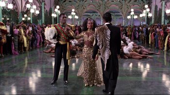Movie still from “Coming to America” (1988), directed by John Landis – A group of people standing in a room; Wide shot, Low angle