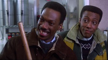 Movie still from “Coming to America” (1988), directed by John Landis – A man with a big smile on his face; Close Up shot, Low angle