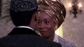Movie still from “Coming to America” (1988), directed by John Landis – A man and a woman are talking to each other; Close Up shot, Over the shoulder angle