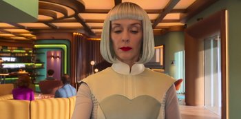 Movie still from “Big Bug” (2022), directed by Jean-Pierre Jeunet – A woman with white hair is looking down at her face; Medium shot, Over the shoulder angle