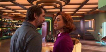 Movie still from “Big Bug” (2022), directed by Jean-Pierre Jeunet – A man and a woman are standing in front of each other in a restaurant; Medium shot, Over the shoulder angle