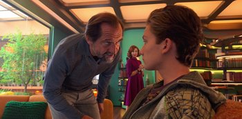 Movie still from “Big Bug” (2022), directed by Jean-Pierre Jeunet – A man and a woman talking to another man in a room; Medium shot, Over the shoulder angle