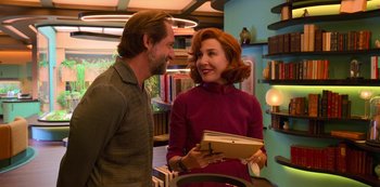 Movie still from “Big Bug” (2022), directed by Jean-Pierre Jeunet – A man and a woman standing next to each other; Medium shot, Over the shoulder angle