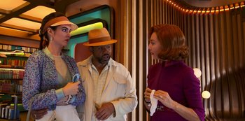 Movie still from “Big Bug” (2022), directed by Jean-Pierre Jeunet – A group of people standing next to each other in a room; Medium shot, Over the shoulder angle