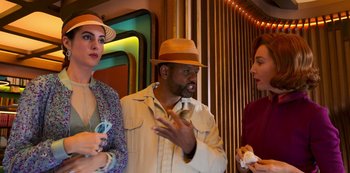 Movie still from “Big Bug” (2022), directed by Jean-Pierre Jeunet – A group of people standing next to each other in a room; Medium shot, Over the shoulder angle