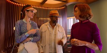 Movie still from “Big Bug” (2022), directed by Jean-Pierre Jeunet – A group of people standing next to each other in a room; Medium shot, Over the shoulder angle