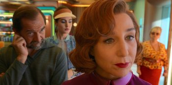 Movie still from “Big Bug” (2022), directed by Jean-Pierre Jeunet – A group of people standing next to each other in a room; Close Up shot, Over the shoulder angle