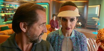 Movie still from “Big Bug” (2022), directed by Jean-Pierre Jeunet – A man and a woman are standing next to each other; Close Up shot, Over the shoulder angle