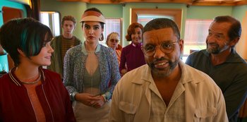 Movie still from “Big Bug” (2022), directed by Jean-Pierre Jeunet – A group of people standing in a room; Medium shot, Low angle