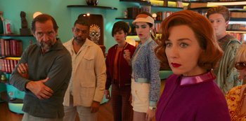 Movie still from “Big Bug” (2022), directed by Jean-Pierre Jeunet – A group of people standing in front of a wall; Medium shot, Low angle