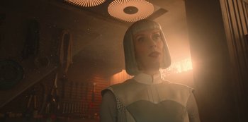 Movie still from “Big Bug” (2022), directed by Jean-Pierre Jeunet – A woman in a white dress and white wig; Close Up shot, Low angle