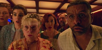 Movie still from “Big Bug” (2022), directed by Jean-Pierre Jeunet – A group of people that are standing in a room together; Close Up shot, Low angle