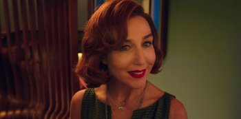 Movie still from “Big Bug” (2022), directed by Jean-Pierre Jeunet – A person wearing a necklace; Close Up shot, High angle