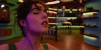 Movie still from “Big Bug” (2022), directed by Jean-Pierre Jeunet – A beautiful woman with her eyes closed and her mouth open; Close Up shot, Low angle